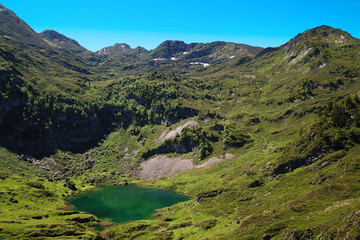 Naklejka na ściany i meble Mountain lake in summer in the mountains of the Pyrenees