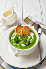 broccoli cream soup in a white bowl