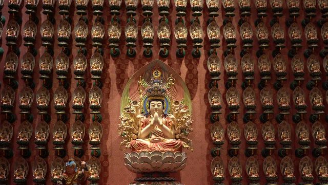 Buddha image in the Chinese temple in Singapore. The Buddha Tooth Relic Temple and Museum is a Buddhist temple and museum complex located in the Chinatown district of Singapore.