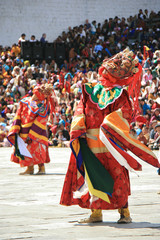 Traditional dances during a religious festival (tsechu) in a dzong in Thimphu (Bhutan)