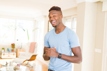 Handsome african young man smiling cheerful with a big smile on face
