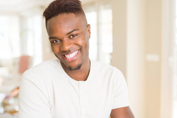 Handsome african young man smiling cheerful with a big smile on face