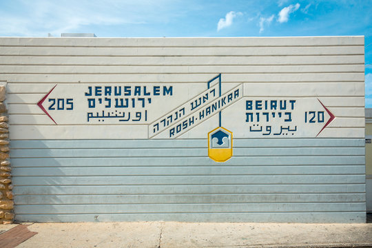 Border sign, showing distance to Jerusalem and Beirut, in Rosh Hanikra - popular tourist site in Israel