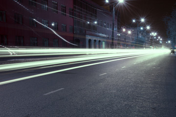 landscapes of the night city with shop windows and busy streets