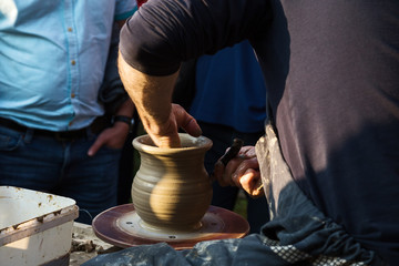 Potter ceramist creat jar on the Baikal