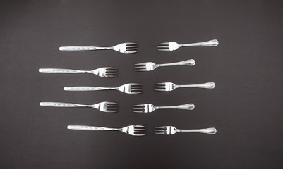 Cutlery set on black table. Concept of cooking and restaurant