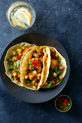 Flapjack aloo gobi chickpeas dark background top view