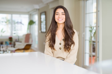 Young beautiful woman at home with a happy and cool smile on face. Lucky person.