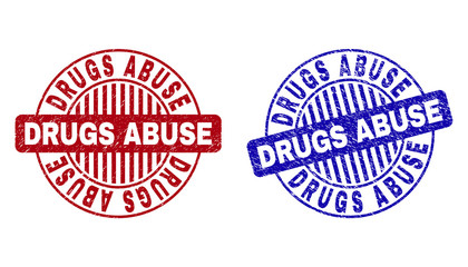 Grunge DRUGS ABUSE round stamp seals isolated on a white background. Round seals with grunge texture in red and blue colors. Vector rubber overlay of DRUGS ABUSE text inside circle form with stripes.