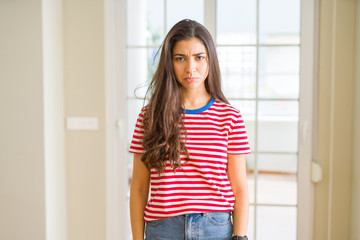Young beautiful woman wearing casual t-shirt depressed and worry for distress, crying angry and afraid. Sad expression.