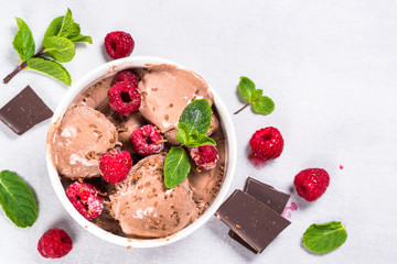 Chocolate ice cream with raspberries.