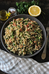 Lemon salad with bulgur and vegetables. Middle Eastern cuisine. Arabic salad tabbouleh.