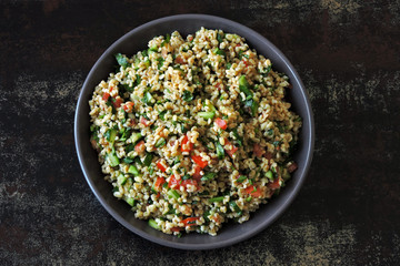Lemon salad with bulgur and vegetables. Middle Eastern cuisine. Arabic salad tabbouleh.