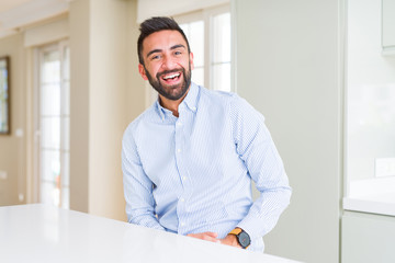 Handsome man smiling cheerful with a big smile on face showing teeth, positive and happy expression