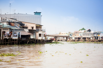 JAN 28 2014 - MY THO, VIETNAM - Houses by a river, on JAN  28, 2014, in  Mekong Delta, Vietnam