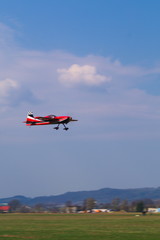 Fototapeta na wymiar RC acrobatic model airplane in the sky