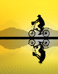 Silhouette woman  and bike relaxing on blurry sky   background.