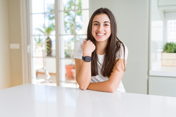 Beautiful young brunette woman smiling cheerful looking at the camera with a big smile on face showing teeth