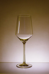 glass of white wine with wave on white background
