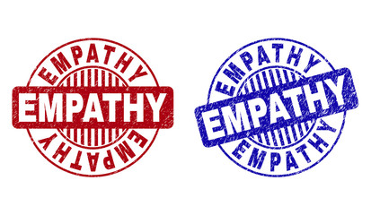 Grunge EMPATHY round stamp seals isolated on a white background. Round seals with grunge texture in red and blue colors. Vector rubber imprint of EMPATHY tag inside circle form with stripes.