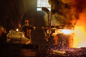 Metallurgists at casting ingots in Foundry Shop, Metallurgical production