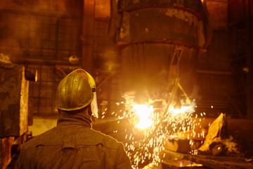 Metallurgists at casting ingots in Foundry Shop, Metallurgical production