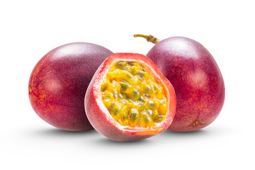 Passion fruits isolated with a half cut fruit where you can see the colorful and juicy seeds