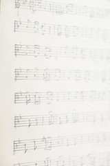 vintage paper sheet with handwritten musical notes