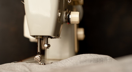 Background type of sewing machine, tailoring process. sewing workshop.