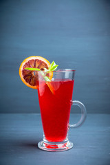 Fruit drink based on raspberry with red orange slice. Selective focus. Shallow depth of field.