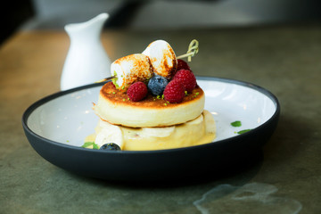 Pancakes with berries and marshmallow