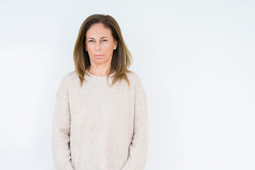 Beautiful middle age woman over isolated background skeptic and nervous, frowning upset because of problem. Negative person.