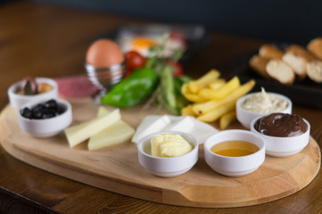at breakfast, cucumber tomato cheese olive tray