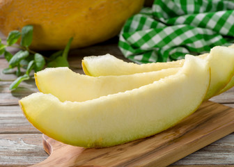 sliced melon on a wooden table