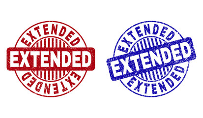 Grunge EXTENDED round stamp seals isolated on a white background. Round seals with grunge texture in red and blue colors. Vector rubber overlay of EXTENDED tag inside circle form with stripes.