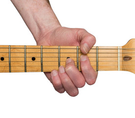 Guitarist&rsquo;s hand playing a chord on a maple fretboard of an electric guitar isolated on white.
