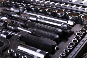 Obraz premium A set of tools in the box, organized workspace.