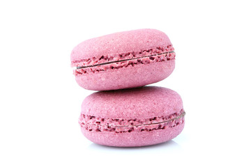 Two pink macarons cookies isolated.