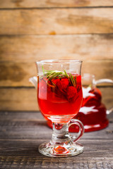 Hot raspberry beverage with rosemary. Selective focus. Shallow depth of field.