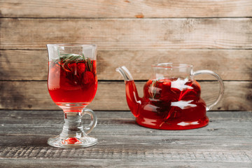 Hot raspberry beverage with rosemary. Selective focus. Shallow depth of field.