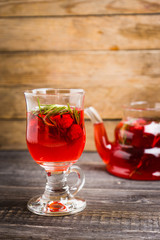Hot raspberry beverage with rosemary. Selective focus. Shallow depth of field.