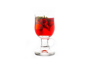 Hot raspberry beverage with rosemary. Selective focus. Shallow depth of field. Isolated on white background.