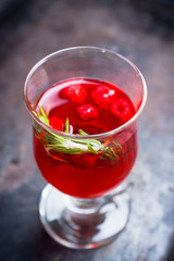 Hot raspberry beverage with rosemary. Selective focus. Shallow depth of field.