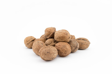 Walnuts on white background. The health benefits of walnuts are many.