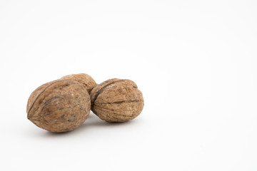 Walnuts on white background. The health benefits of walnuts are many.