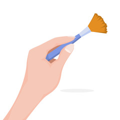Hand holding makeup brush