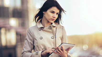 Business woman with a digital tablet on the background of a mod