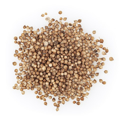 Heap of dried coriander seeds isolated on white background