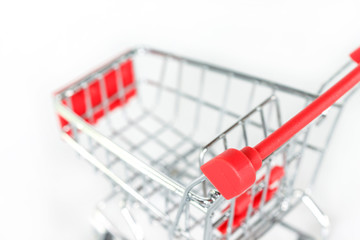 red shopping cart on white background.