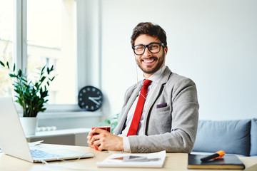 Young man working from home office
